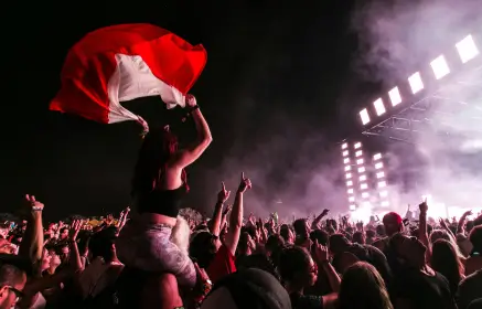 Girl with a flag over people